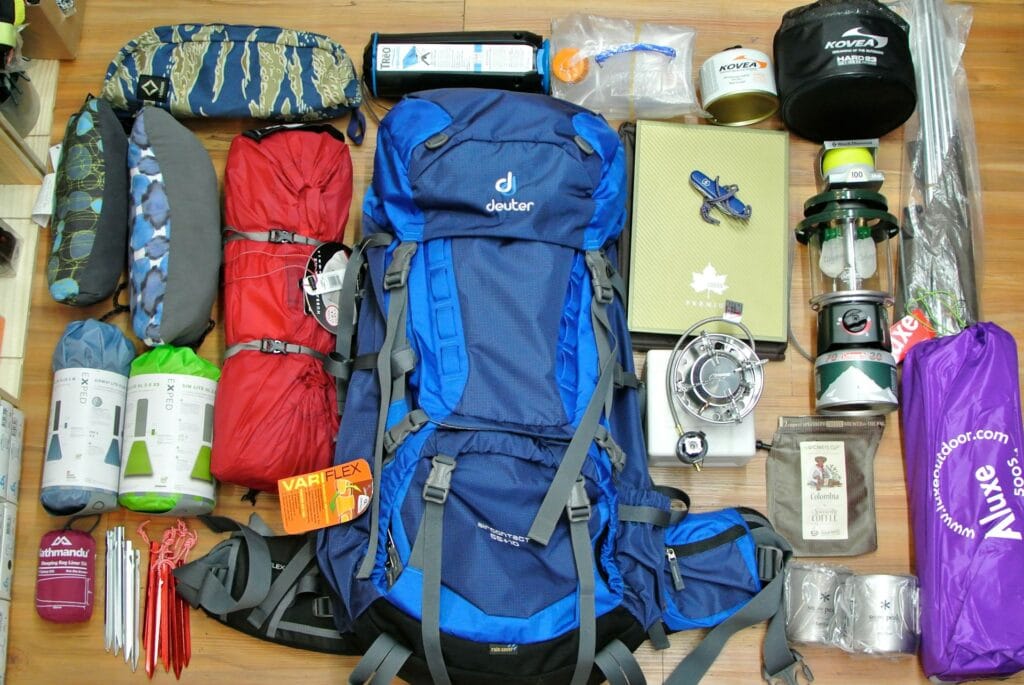 packing essentials including jacket and trekking shoes