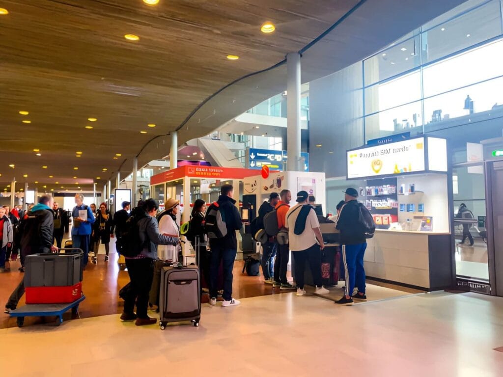Tourist buying SIM card at airport