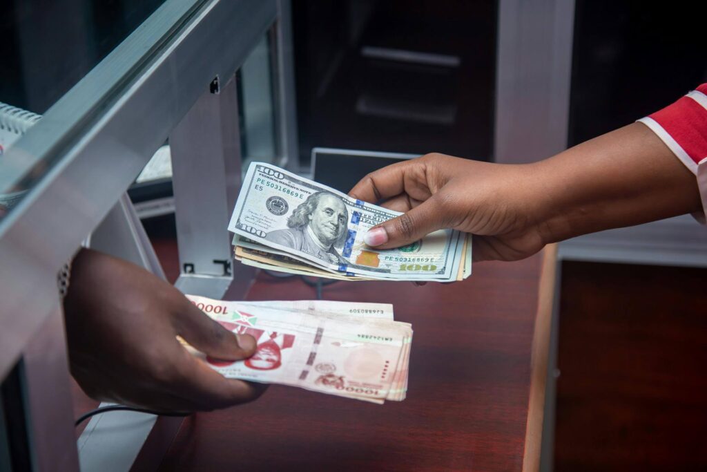 Person handing over money at an authorized bank counter