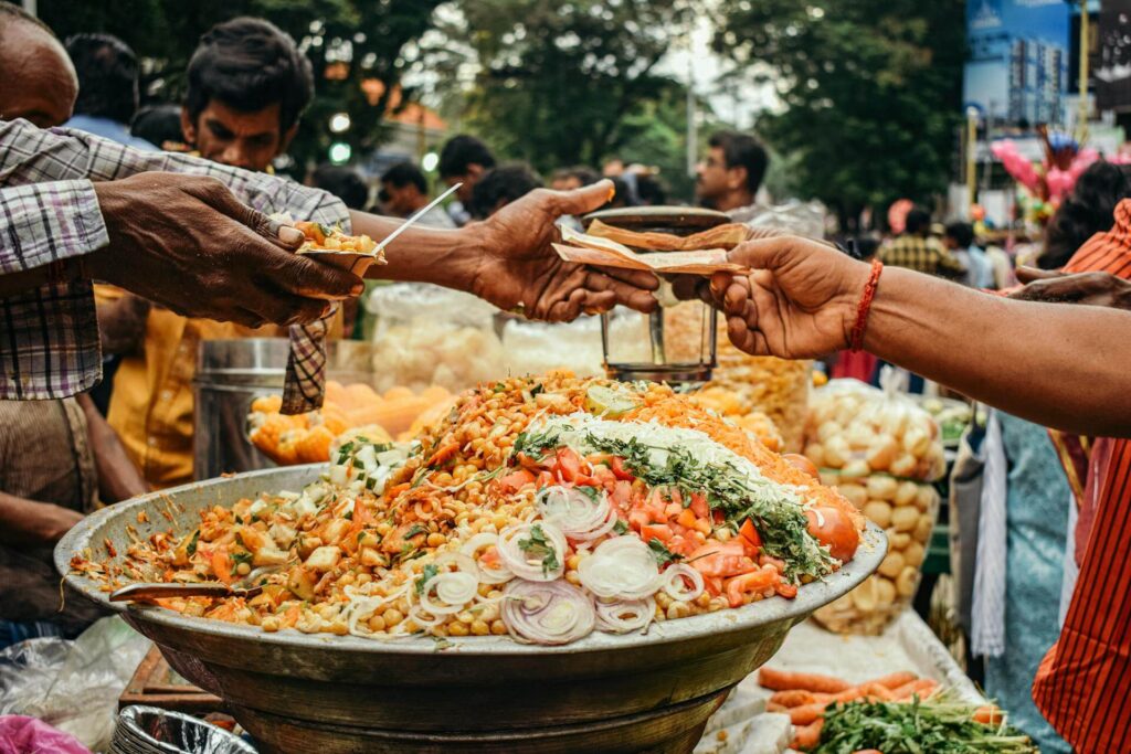 Freshly cooked Indian street food prepared at a busy food stall.