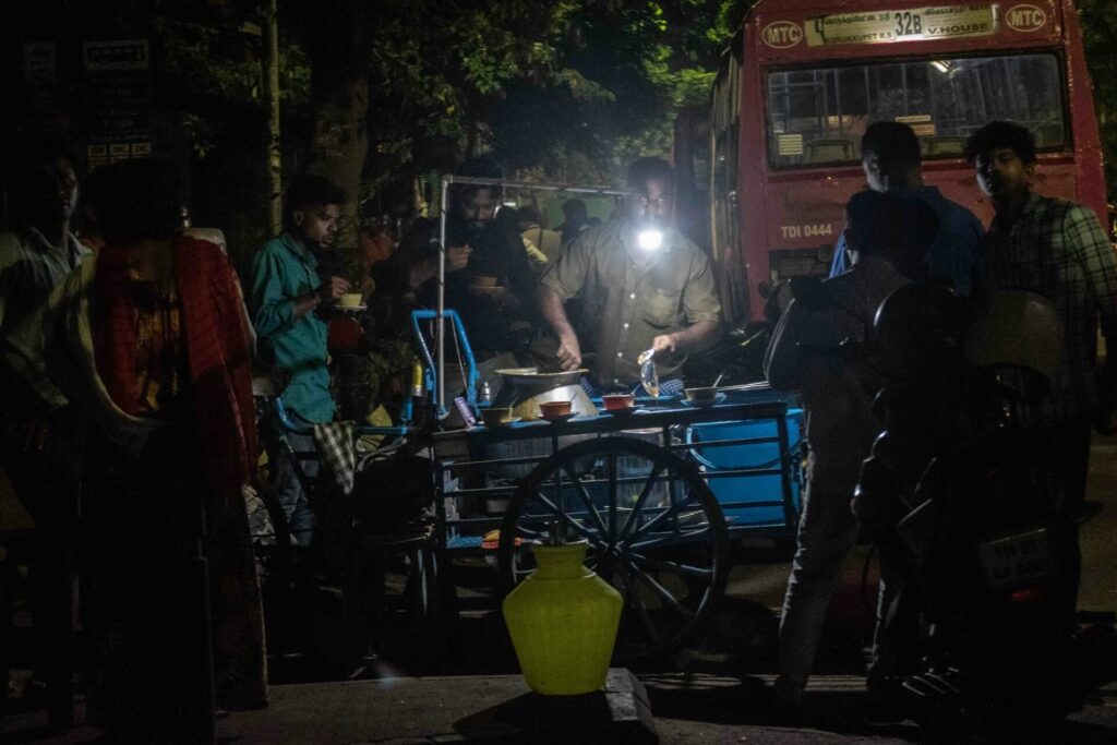 busy Indian street food stall with fresh cooking