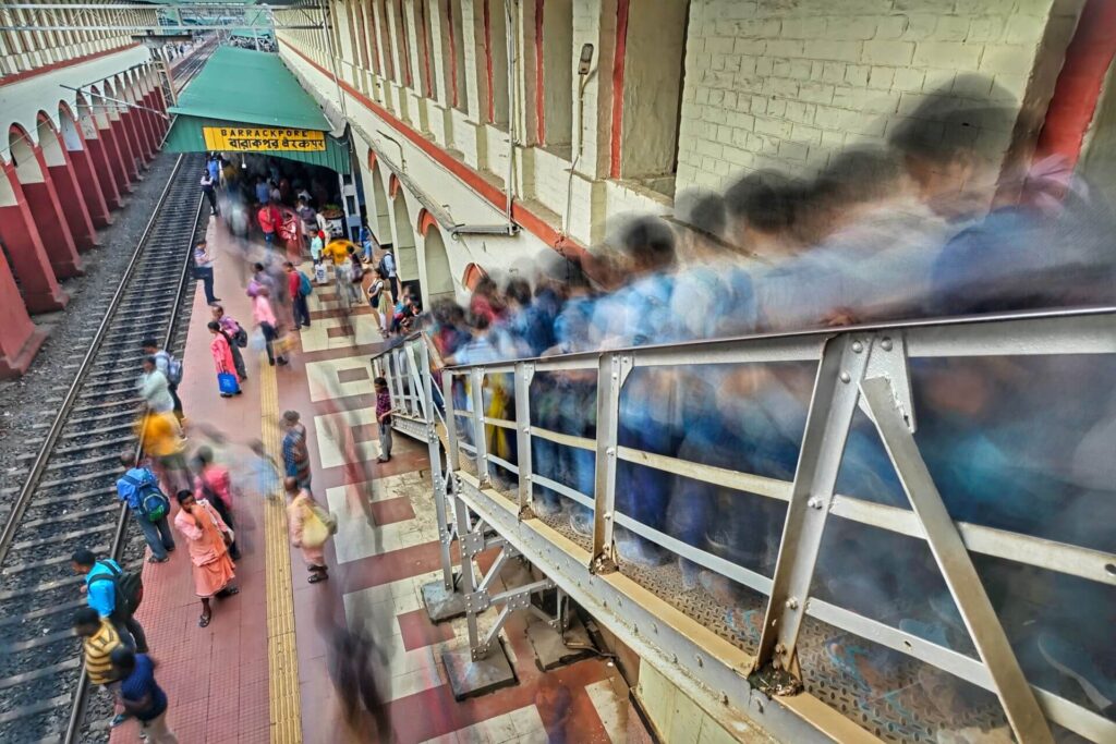 Indian railway station platform travelers